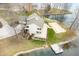 Breathtaking aerial view of a lakefront home with a private dock, pool, and stunning waterfront scenery at 2001 E Ely Ct, Martinsville, IN 46151