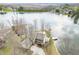 Stunning aerial view of waterfront home, lush landscape, and serene lake, perfect for peaceful living at 2001 E Ely Ct, Martinsville, IN 46151