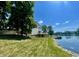 Spacious backyard with a lake view, deck, and access to the water at 2001 E Ely Ct, Martinsville, IN 46151