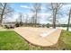 Lakeside backyard with concrete pool cover, patio area, and views of the tranquil lake at 2001 E Ely Ct, Martinsville, IN 46151