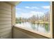 Balcony view of lakefront property with calm waters and blue skies at 2001 E Ely Ct, Martinsville, IN 46151