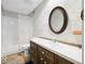 Bathroom featuring vanity with wooden cabinetry, tub, and unique wallpaper at 2001 E Ely Ct, Martinsville, IN 46151