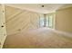 Cozy bedroom with angled wood-paneled wall and bright corner window at 2001 E Ely Ct, Martinsville, IN 46151