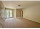 A spacious bedroom has large windows, neutral walls, and plush carpeting at 2001 E Ely Ct, Martinsville, IN 46151