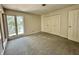 A bright bedroom boasts large windows offering serene views and spacious closet at 2001 E Ely Ct, Martinsville, IN 46151