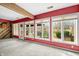 Large bonus room with red walls and multiple windows providing lots of natural light and scenic views at 2001 E Ely Ct, Martinsville, IN 46151