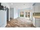 Spacious dining area with hardwood flooring, large windows, and neutral color palette at 2001 E Ely Ct, Martinsville, IN 46151
