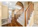 Grand entryway with staircase, hardwood floors, and stone accent wall at 2001 E Ely Ct, Martinsville, IN 46151