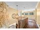 Grand foyer with stone accent wall, hardwood floors, and decorative light fixtures at 2001 E Ely Ct, Martinsville, IN 46151