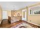 Inviting hallway with hardwood floors, a stone accent wall, and stylish lighting, creating a warm ambiance at 2001 E Ely Ct, Martinsville, IN 46151