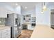 Modern kitchen with stainless steel appliances, a built-in oven, and a breakfast bar, perfect for Gathering meals at 2001 E Ely Ct, Martinsville, IN 46151