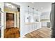 Bright, updated kitchen with large island, white cabinets, stainless steel appliances, and hardwood floors at 2001 E Ely Ct, Martinsville, IN 46151