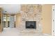 Living room showcasing stone fireplace and access to a private balcony at 2001 E Ely Ct, Martinsville, IN 46151
