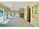 Bright living room with lake views, a stone fireplace, and built-in shelving at 2001 E Ely Ct, Martinsville, IN 46151
