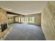 Bright living room with stone fireplace and scenic water views at 2001 E Ely Ct, Martinsville, IN 46151