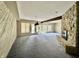 Spacious living room features a stone fireplace and water views at 2001 E Ely Ct, Martinsville, IN 46151