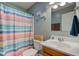 Bathroom featuring a sink, a toilet, and a shower with striped shower curtain at 2125 Jason Dr, Lebanon, IN 46052