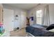 Bedroom featuring light gray walls, wood floors, a window and two closets at 2125 Jason Dr, Lebanon, IN 46052