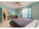 Bedroom with light blue walls, a ceiling fan, and a TV set on top of a dresser at 2125 Jason Dr, Lebanon, IN 46052