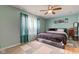 Primary bedroom with wood flooring, ceiling fan, and natural light at 2125 Jason Dr, Lebanon, IN 46052