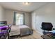 This bedroom features a bed, a desk and a window that lets in plenty of light at 2125 Jason Dr, Lebanon, IN 46052