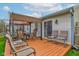 Outdoor deck features patio furniture, a covered area, and sliding glass doors to the home at 2125 Jason Dr, Lebanon, IN 46052