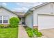 The home has a covered entrance porch with decorative plants and a seating area near the front door at 2125 Jason Dr, Lebanon, IN 46052