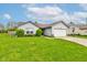 Charming single-story home with a well-maintained lawn, mature landscaping, and an inviting curb appeal at 2125 Jason Dr, Lebanon, IN 46052