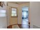 A light-filled foyer leads to the living spaces, showcasing beautiful wood floors and a view of the bedroom at 2125 Jason Dr, Lebanon, IN 46052
