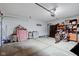 View of garage interior with concrete floors, an open door and storage against the back wall at 2125 Jason Dr, Lebanon, IN 46052