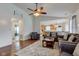 Inviting living room featuring a ceiling fan, hardwood floors, area rug, and comfortable seating at 2125 Jason Dr, Lebanon, IN 46052