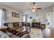 Cozy living room with a ceiling fan, a modern entertainment unit, and plush seating for a comfortable retreat at 2125 Jason Dr, Lebanon, IN 46052