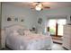 This charming bedroom is full of light and features art on the walls at 215 Fairway Ct, Franklin, IN 46131