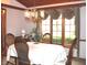 Elegant dining room with wood paneled walls and a chandelier at 215 Fairway Ct, Franklin, IN 46131
