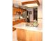 Kitchen featuring wooden cabinets, a stainless steel refrigerator, and tile flooring at 215 Fairway Ct, Franklin, IN 46131