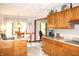 Bright kitchen with light countertops, wooden cabinets, and a view of the backyard at 215 Fairway Ct, Franklin, IN 46131