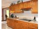 Updated kitchen showcasing wooden cabinets and modern stainless steel appliances at 215 Fairway Ct, Franklin, IN 46131