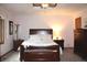 Relaxing main bedroom featuring neutral tones, ceiling fan, and wood furniture at 215 Fairway Ct, Franklin, IN 46131