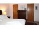 The main bedroom features wood trim, closet, drawers, ceiling fan, and comfortable bedding at 215 Fairway Ct, Franklin, IN 46131