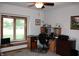 Bright office space with large window, ceiling fan, and built in desk and shelving at 215 Fairway Ct, Franklin, IN 46131