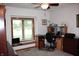 Bright office space with large window, ceiling fan, and built in desk and shelving at 215 Fairway Ct, Franklin, IN 46131
