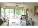 Relaxing sun room with plenty of light, comfortable furniture, and a view of the backyard at 215 Fairway Ct, Franklin, IN 46131