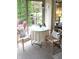 Bright sun room with a bistro table and outdoor views at 215 Fairway Ct, Franklin, IN 46131