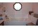 Enjoy a relaxing soak in this tub under an octagon window at 215 Fairway Ct, Franklin, IN 46131