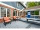 A patio with chairs, an accent table, and a bench are features of this back exterior at 225 Yorkshire E Blvd, Indianapolis, IN 46229