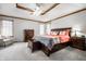 Large bedroom featuring a coffered ceiling and a luxurious upholstered bed at 225 Yorkshire E Blvd, Indianapolis, IN 46229