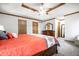 Spacious bedroom with a coffered ceiling and natural wood door trim at 225 Yorkshire E Blvd, Indianapolis, IN 46229