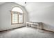 Bedroom with carpet, desk, large window with arch and neutral paint at 225 Yorkshire E Blvd, Indianapolis, IN 46229
