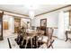 Elegant dining room featuring a chandelier, wood trim, and ample seating at 225 Yorkshire E Blvd, Indianapolis, IN 46229