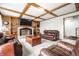 Cozy living room features a fireplace, hardwood floors, and comfortable leather seating at 225 Yorkshire E Blvd, Indianapolis, IN 46229
